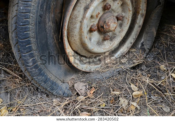 Detail Shot of a Flat Tire on a Old Car Selection\
Focus on Tire