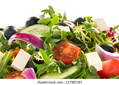 Detail shot of greek salad on a white plate