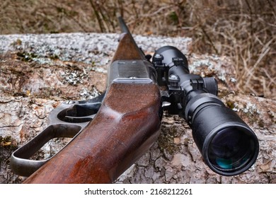 Detail shot of lever-action hunting rifle with scope