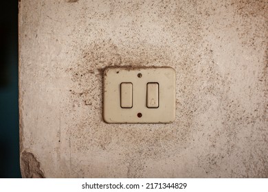 Detail shot of Old light switch in a wall