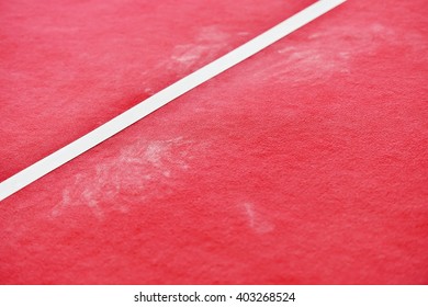 Detail Shot With Red Gymnastics Floor And Traces Of Chalk