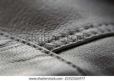Detail shot of supple leather jacket with stitching, shallow focus