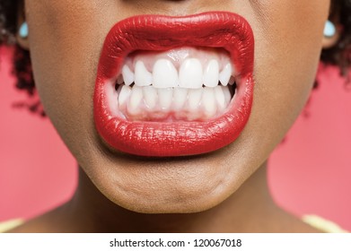 Detail Shot Of Woman Clenching Teeth