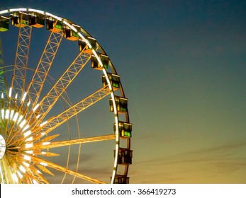 Detail And Silhouette of Ferris Wheel with Sun Set - Powered by Shutterstock