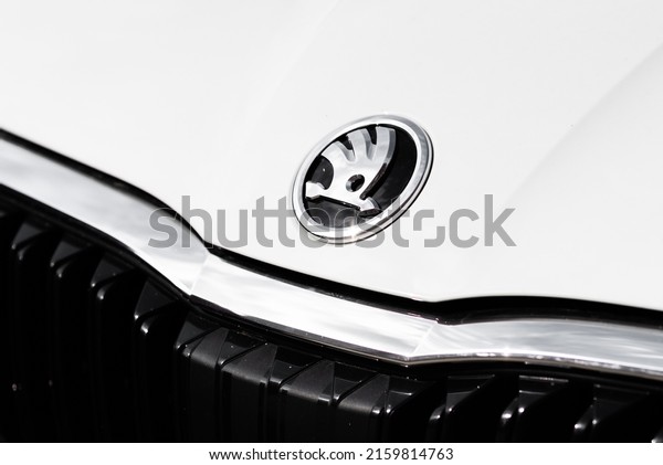 Detail of Skoda Auto brand logo. Symbol of\
Czech car maker and producer. Close-up of the Skoda logo on a white\
car. Russia, Rostov-on-Don\
23may2022