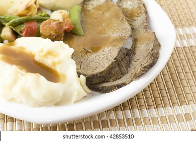 Detail Of Sliced Roast Beef With Mashed Potatoes And Gravy