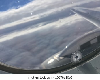 A Detail Of A Small Hole In Plane´s Window. It Is Used For Pressure Balance, Heat Regulation  And Against Condensation.