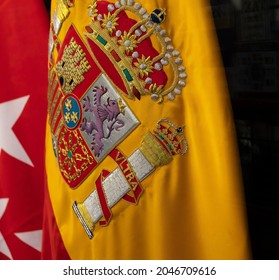 Detail of the Spanish flag fabric with embroidered coat of arms. - Shutterstock ID 2046709616