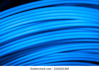 Detail Of A Spool Of Blue Fiber Optics Cable As High Speed Gigabit Internet Abstract