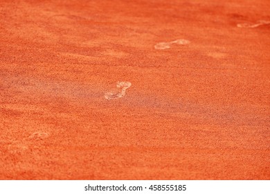 Detail With Sport Shoe Footprints On A Tennis Clay Court