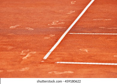 Detail With Sport Shoe Footprints On A Tennis Clay Court