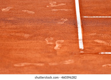 Detail With Sport Shoe Footprints On A Tennis Clay Court