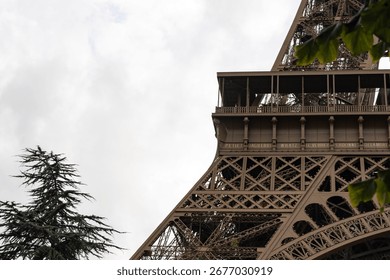 Detail of the structure of the Eiffel Tower seen from below on a cloudy day