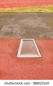 Detail Of Take-off Board On Track And Field For Pole Vault High Jump. Winter Season, Abandoned Playground