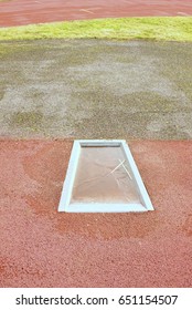 Detail Of Take-off Board On Track And Field For Pole Vault High Jump. Winter Season, Abandoned Playground