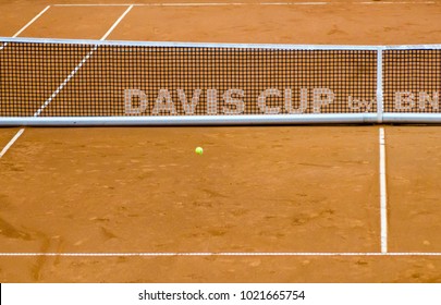 Detail Of Tennis Net With Blurred Ball And Text Davis Cup On Clay Court 