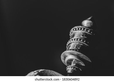 Detail of a Tibetan hand prayer wheel between light and shadow