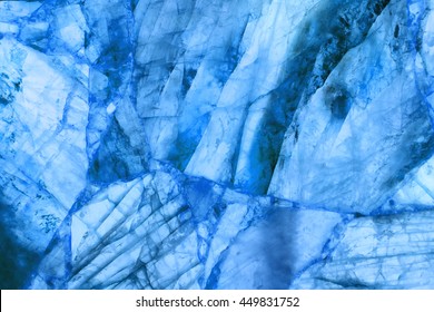 detail of a translucent slice of natural quartz agate marble stone. natural patterns and textures of minerals for background. backgrounds and wallpapers. abstract background