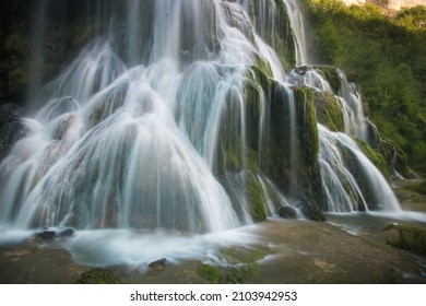 detail of the tuffs waterfall at Baumes les Messieurs in the Jura region of France - Shutterstock ID 2103942953
