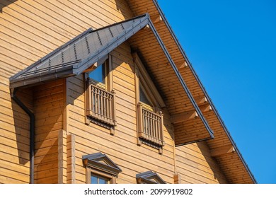 Detail of Ukrainian traditional rural wooden house, background exterior facade with windows frame. Kyiv, Ukraine