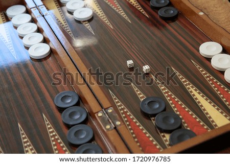 Detail view of backgammon game which is a delightful activity. depth of field.