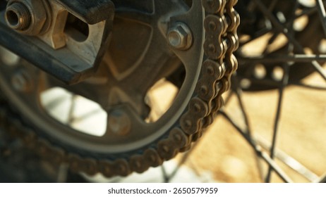 Detail view of the chain of motocross bike. Engine and gear detail.