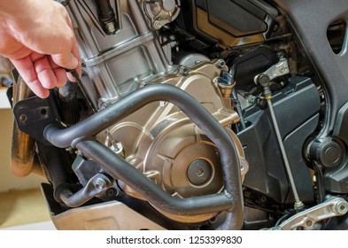 Detail view control of oil level in motorcycle engine. - Shutterstock ID 1253399830
