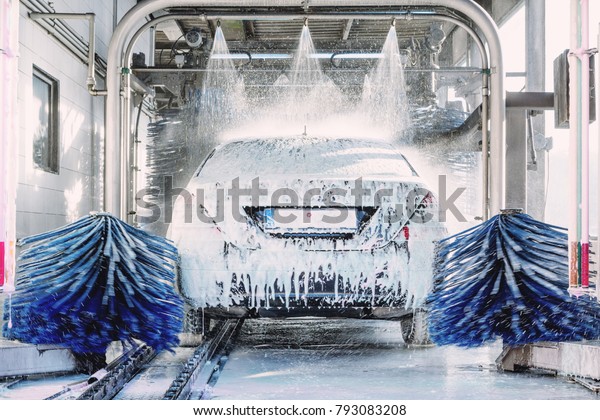 detail view on car wash, car wash foam water,\
Automatic car wash in\
action