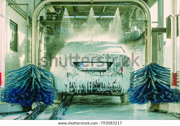 detail view on car wash, car wash foam water,\
Automatic car wash in\
action