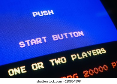 Detail view on old vintage video game with text Push start button, with option to select one or two players - Powered by Shutterstock - Get 15% off with code: PIKWIZARD15