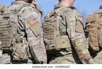 Detail view of the US Army uniform worn by soldiers in a military base. Flag of America on the uniform. - Shutterstock ID 2145891607