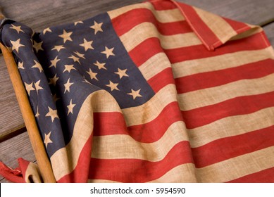 detail of a vintage american flag on a wood table