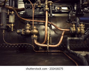 Detail of vintage machine with pipes and valves