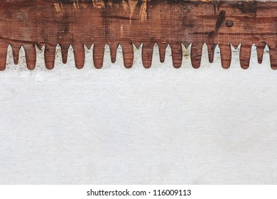 Detail of a vintage saw blade on weathered wood