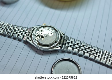 Detail of watch machinery on the table.