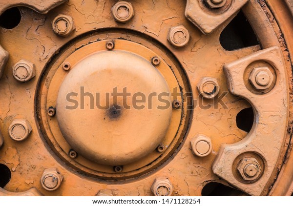 Detail of the\
wheel of a big forklift\
machine.