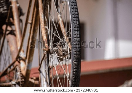 detail of the wheel of an old and rusty bicycle