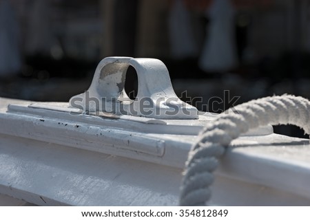 Detail of White Rowlock / Close up of a white rowlock with a rope defocused - Liguria, Italy