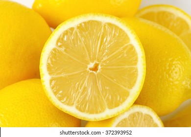 detail of whole and halved ripe lemons - Powered by Shutterstock