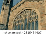 Detail from a window of the dining hall on the Law Quad - the campus of the University of Michigan Law School (Ann Arbor) at Sunset.