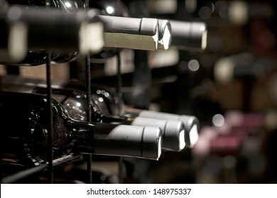 Detail from wine cellar with resting bottles