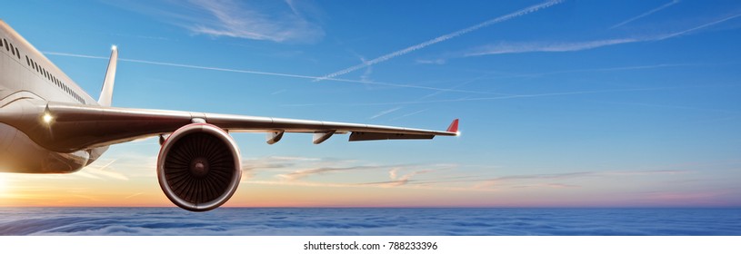 Detail Of Wing Of Commercial Airplane Jetliner Flying Above Clouds In Beautiful Sunset Light. Travel And Business Concept