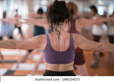 Detail Of A Woman In A Bikram Yoga Class. Asana