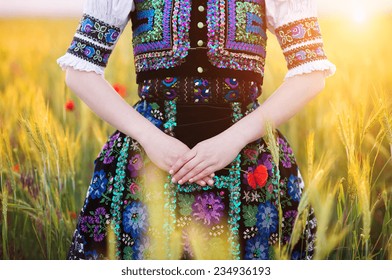 Detail Of Woman Dress. She Is Wearing Traditional Eastern Europe Folk Costumes.