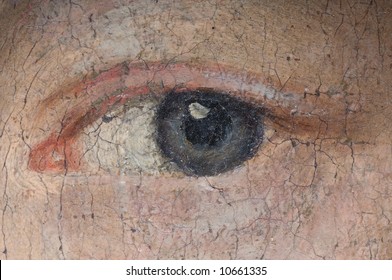 Detail of a woman's eye on an old baroque oil painting.