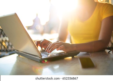 Detail Of Woman's Hand Typing On A Laptop Keyboard.