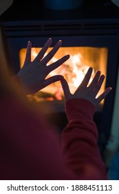 Detail Of Woman's Hands In Front Of The Fire To Keep Warm