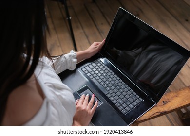 Detail Of A Woman's Hands Using The Mouse Of A Laptop With Top View