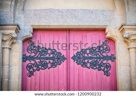 detail of the wooden door of Saint Jean-Baptiste Church in Montaigu, France