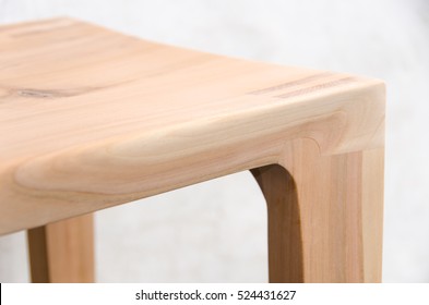 Detail of a wooden glued joint of a chairs leg. Material used for the stool  is cherry wood untreated with a sanded finish